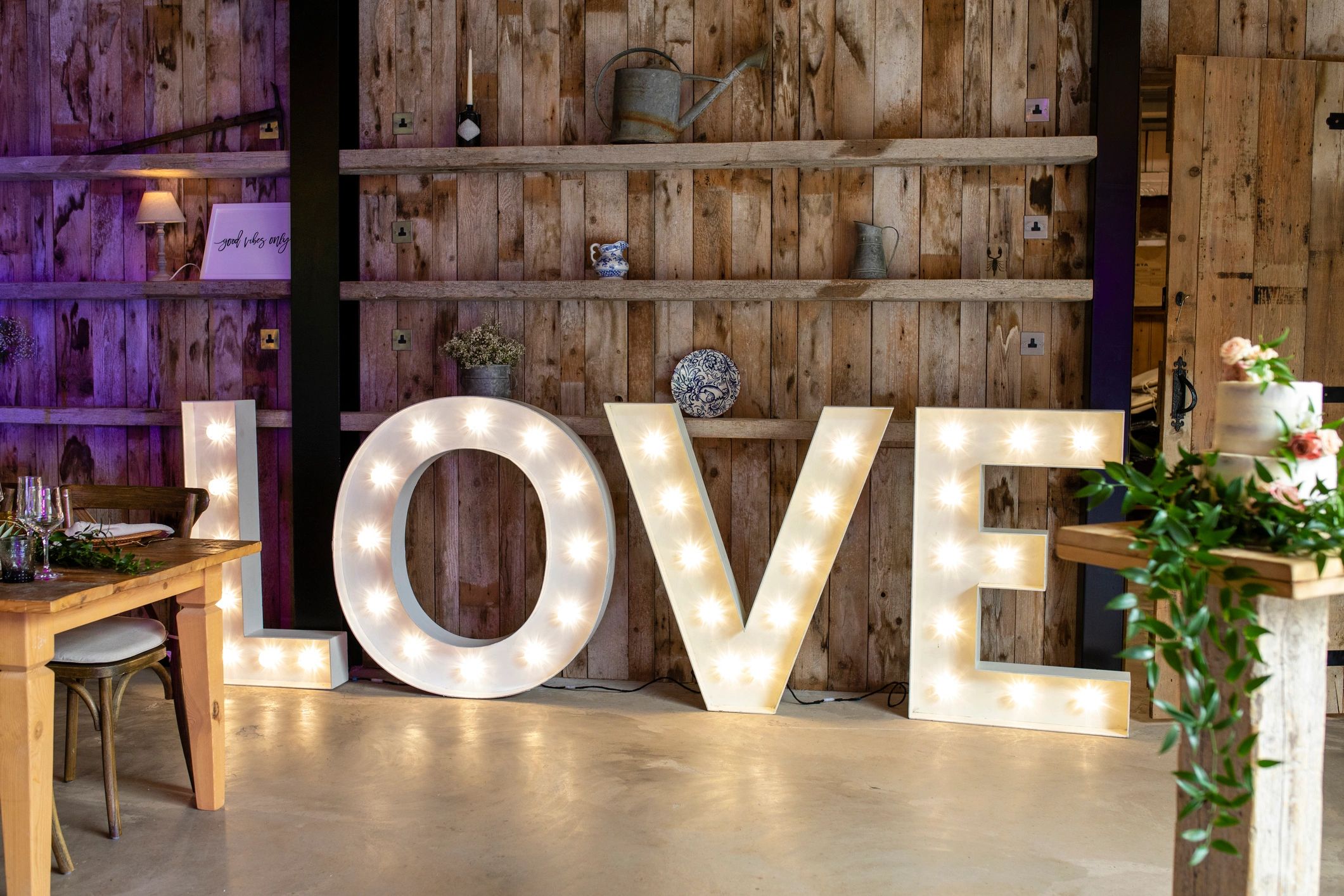 Decorated event setting with illuminated brand-style letters
