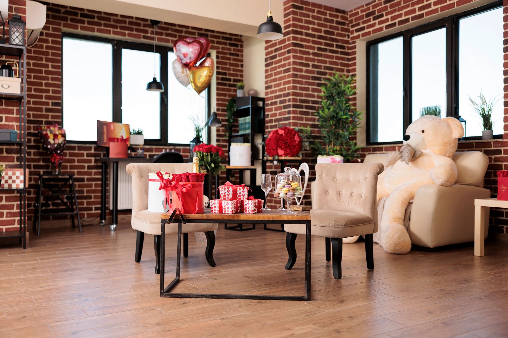 Celebration setup with gifts, flowers, and decorative details