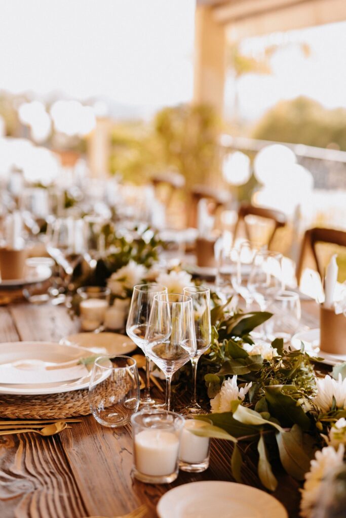 Fresh mediterranean boho wedding banquet table outdoors