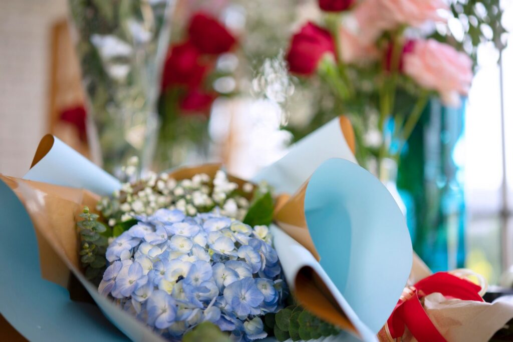 Young entrepreneurs are working at flower shop.