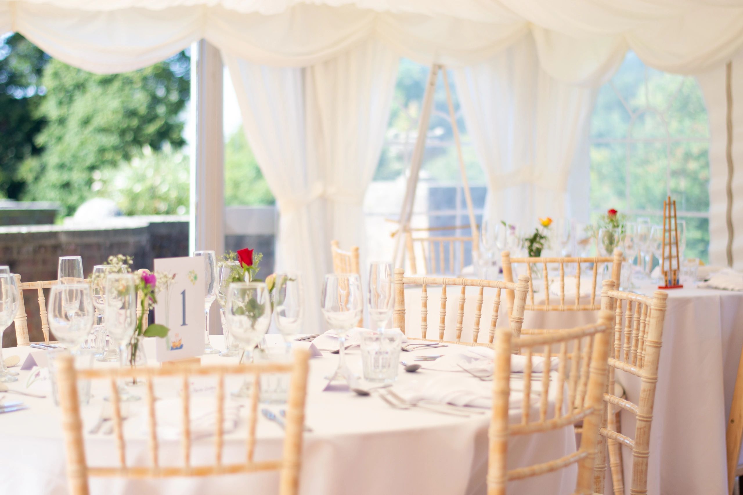 Elegant wedding reception table styling inside marquee