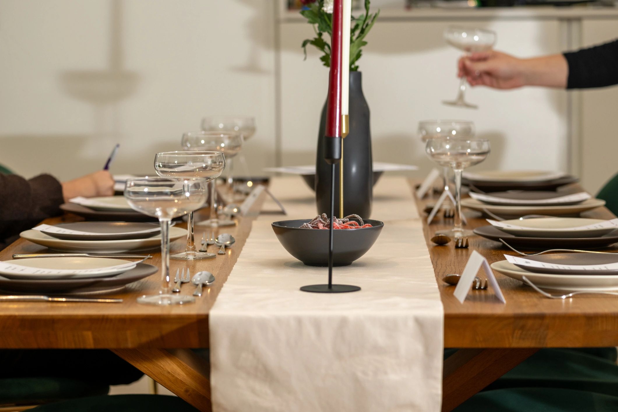 Formal dinner table setting with glassware and candles