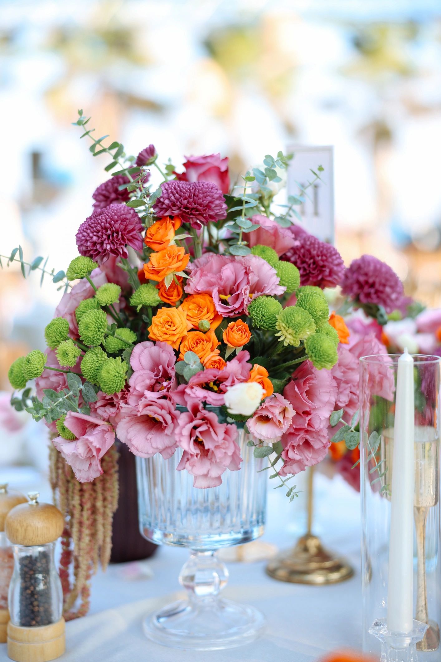 Decorated outdoor wedding table with fresh flowers