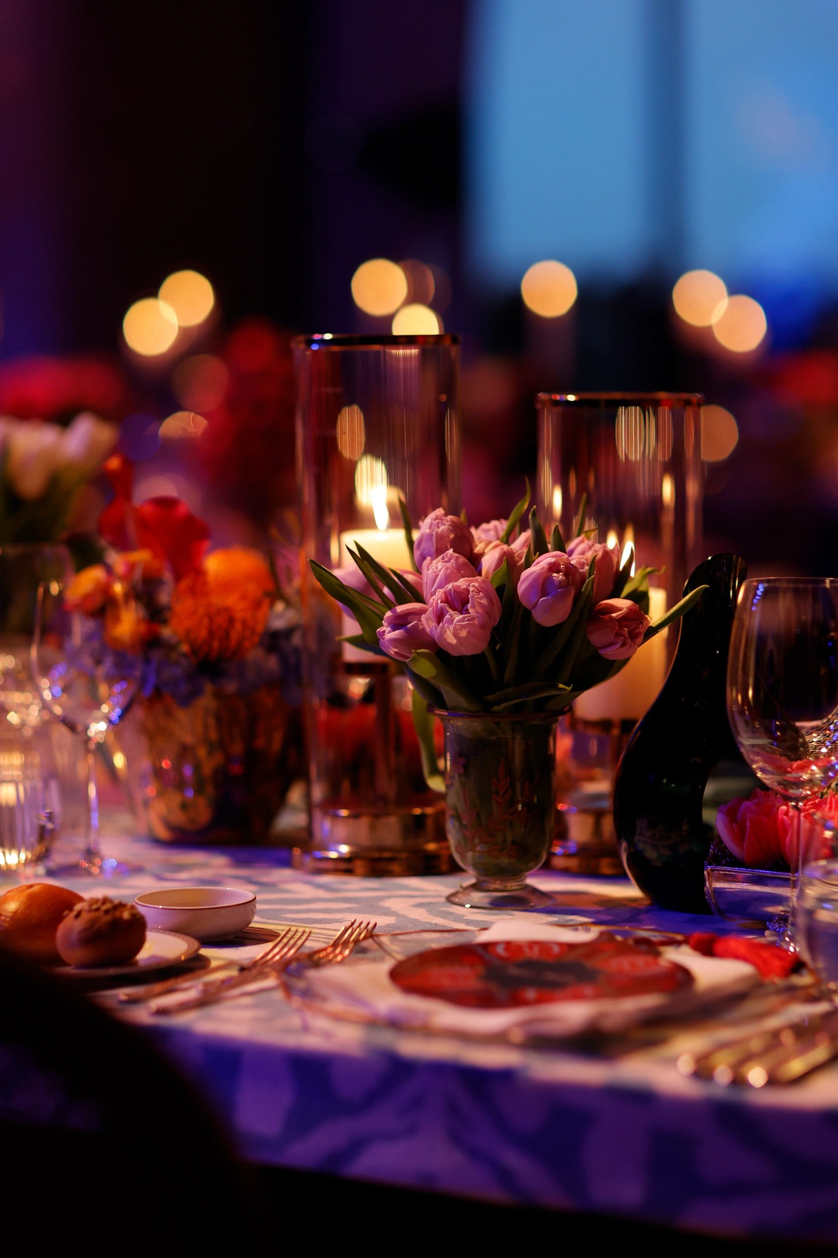 Luxurious festive dinner table with candlelight and flowers