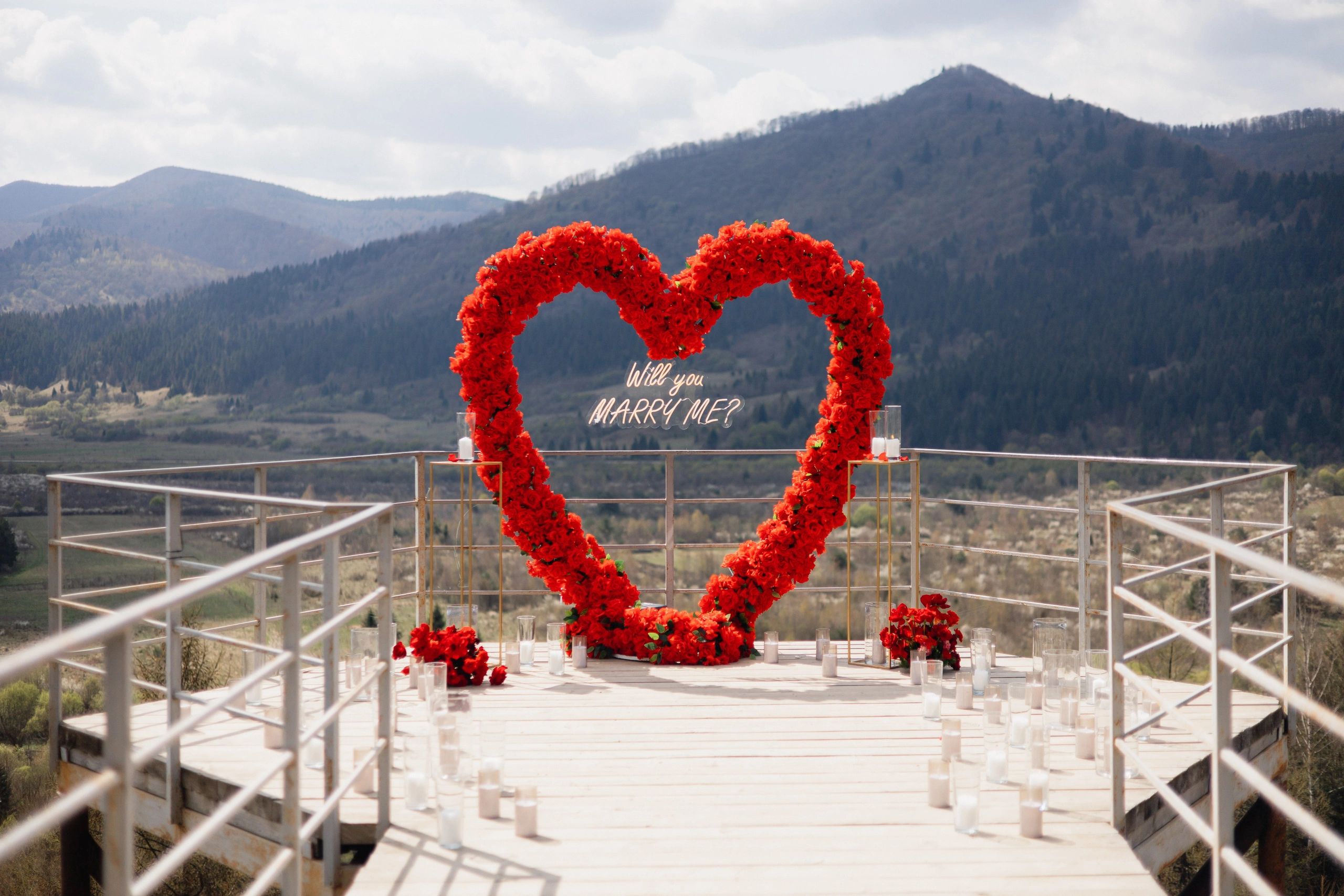 Romantic floral event styling with scenic backdrop