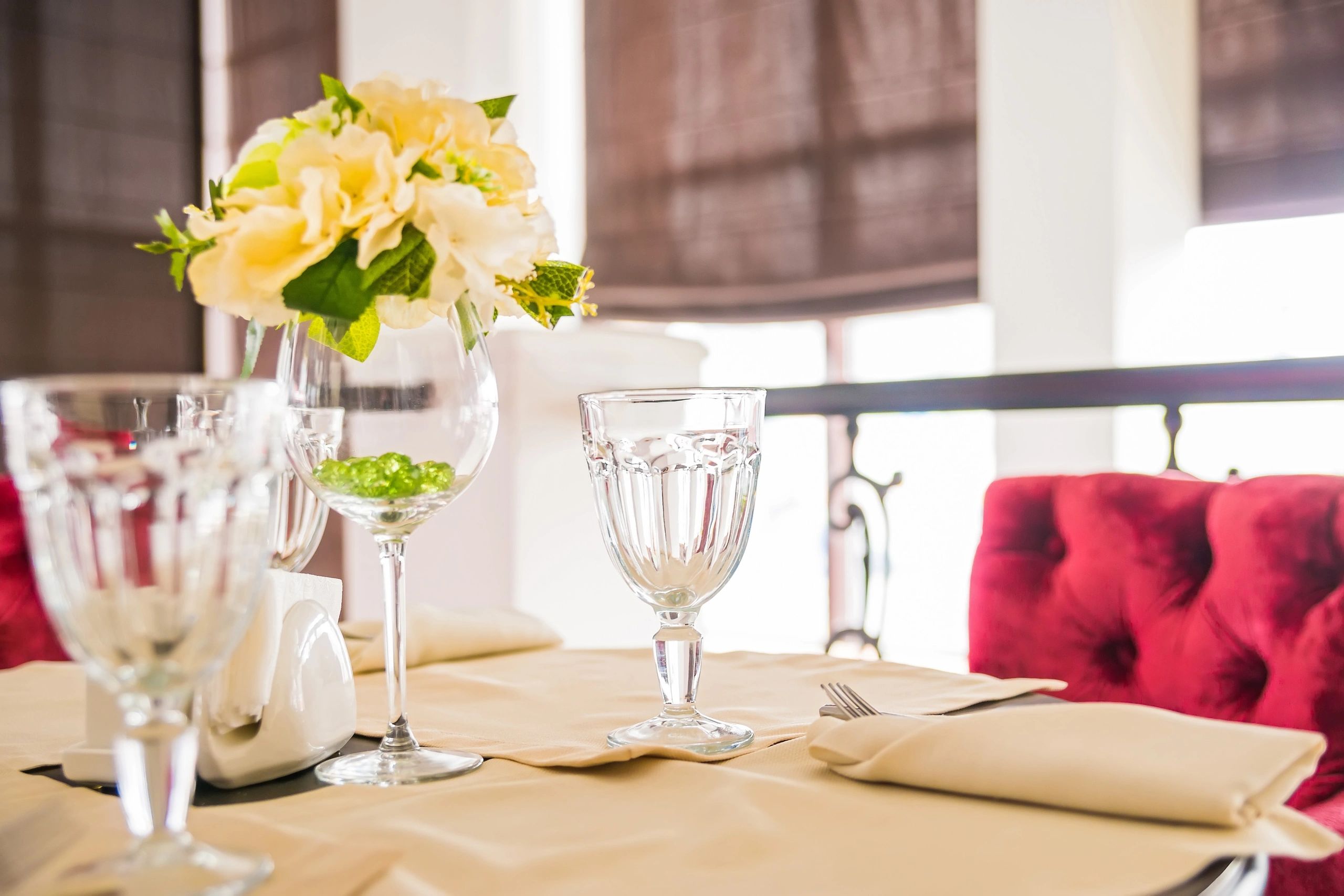 Elegant indoor table setting with flowers and glassware